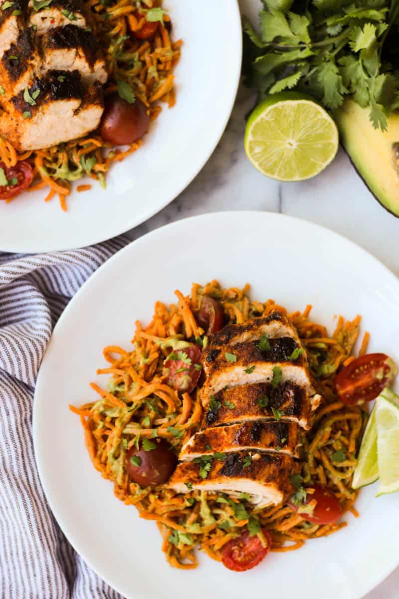 One pan & 30 minutes for this Chili Dusted Chicken & Sweet Potato Noodles with Avocado Sauce. Packed with protein, carbs, and healthy fats to make an easy gluten free, paleo, and Whole30 approved dish - Eat the Gains