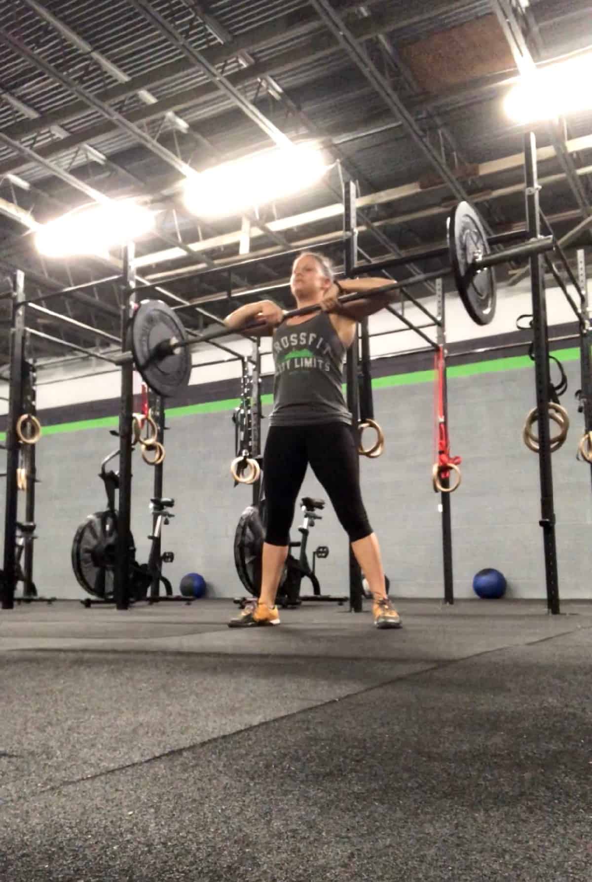Girl doing a sumo deadlift high pull