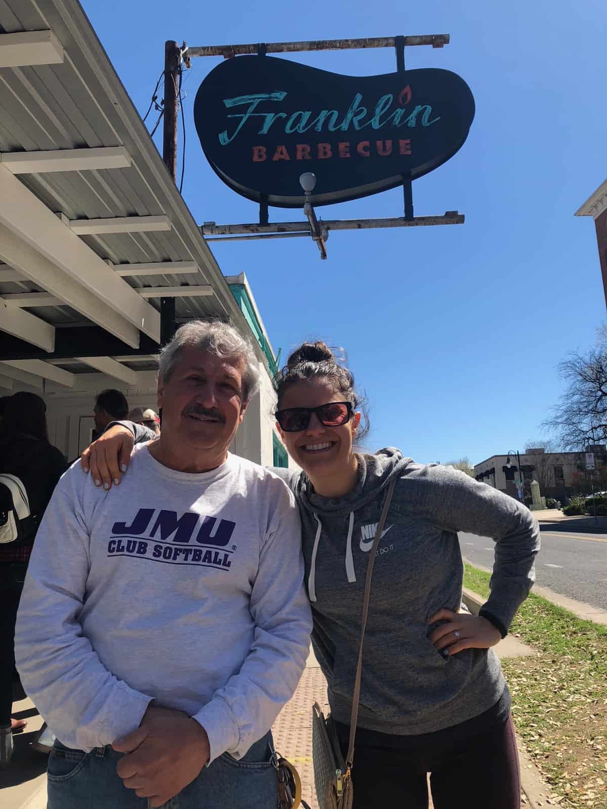Girl and her dad waiting outside at Franklin BBQ