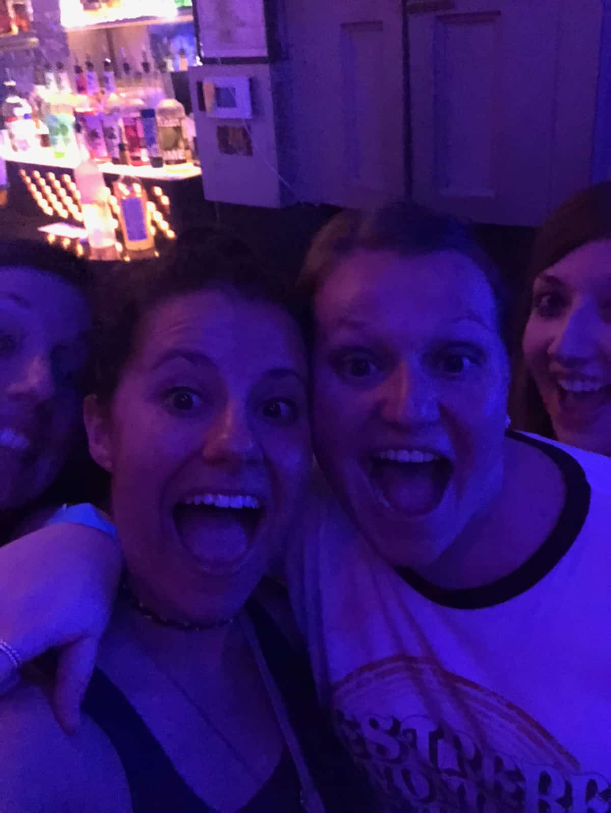 Two girls in a night club having fun