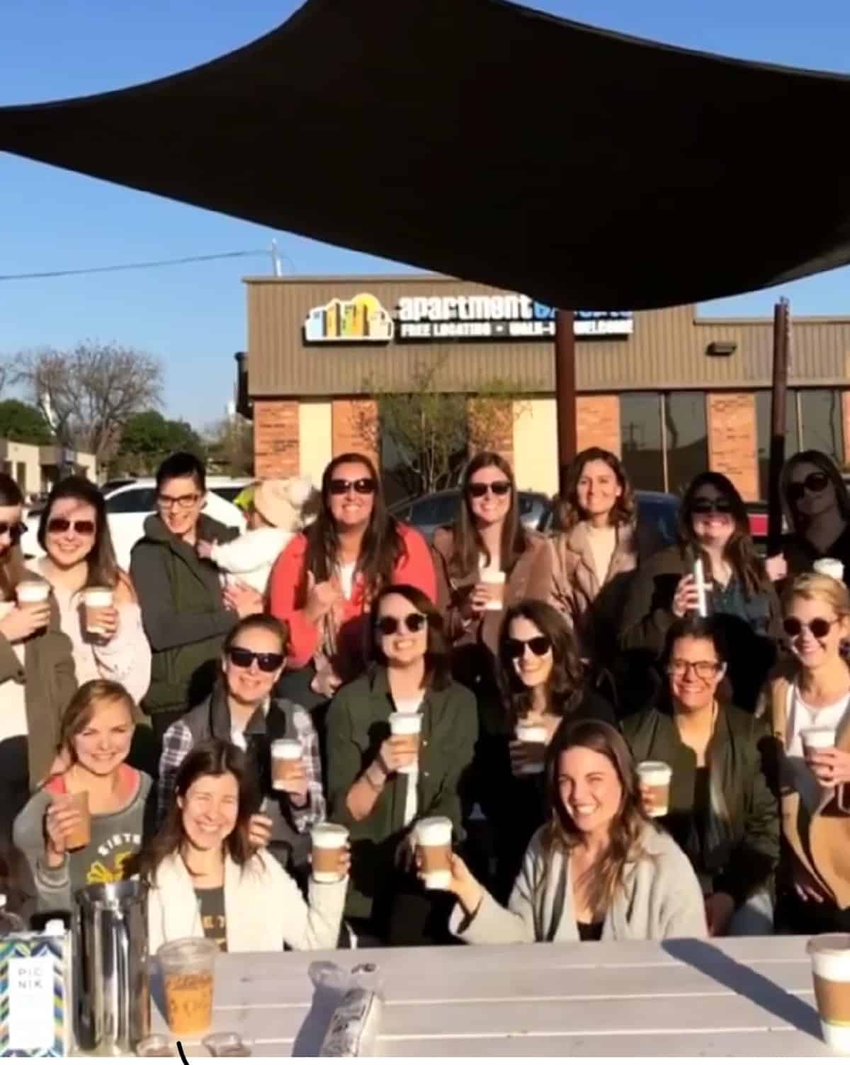 Group of ladies outside enjoying coffee
