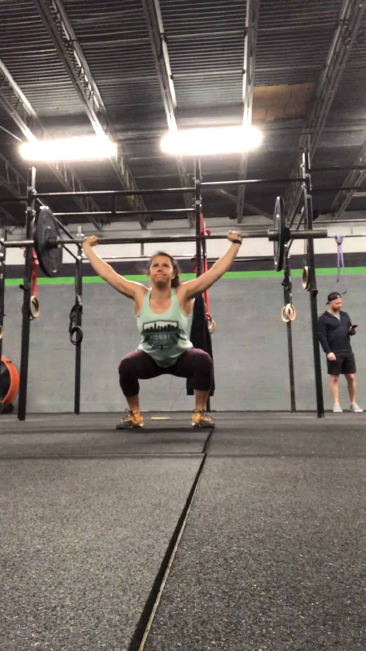 Girl doing an overhead squat