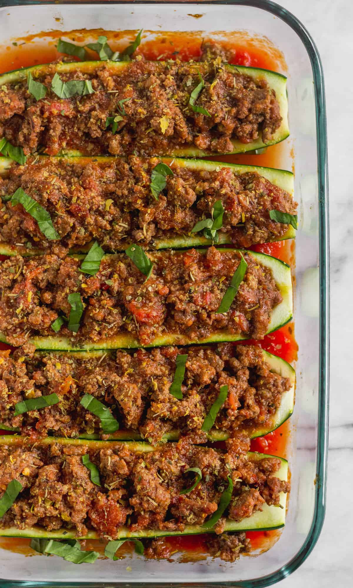 Pan filled with 5 zucchini boats stuffed with Italian seasoned beef