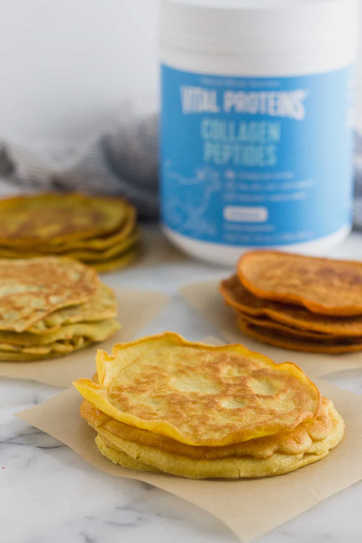 4 different kinds of paleo protein tortillas surrounding a container of collagen peptides