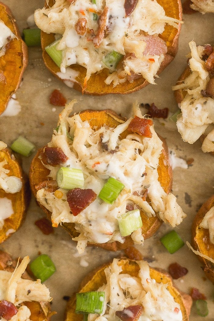 A bunch of individual chicken bacon ranch whole30 pizza on a baking sheet