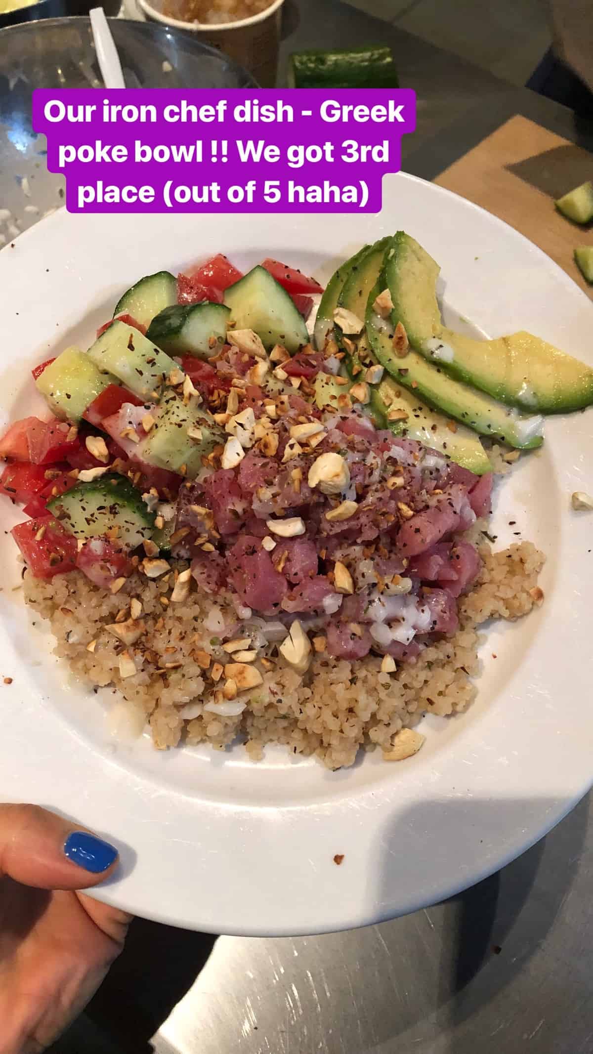 Mediterranean style poke bowl with quinoa, tuna, tomato, cucumbers, and avocado