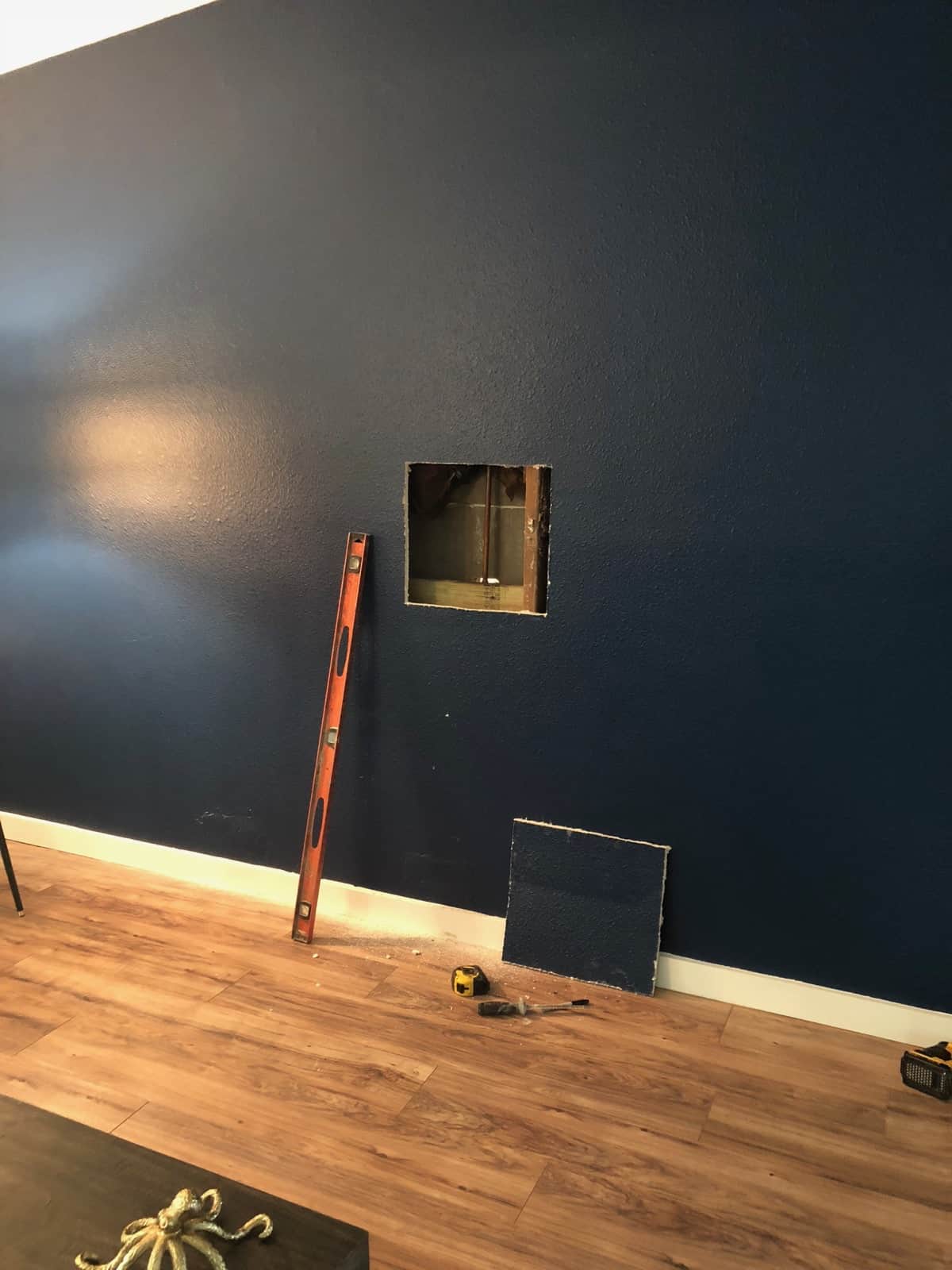 Blue wall with a hole cut out of it