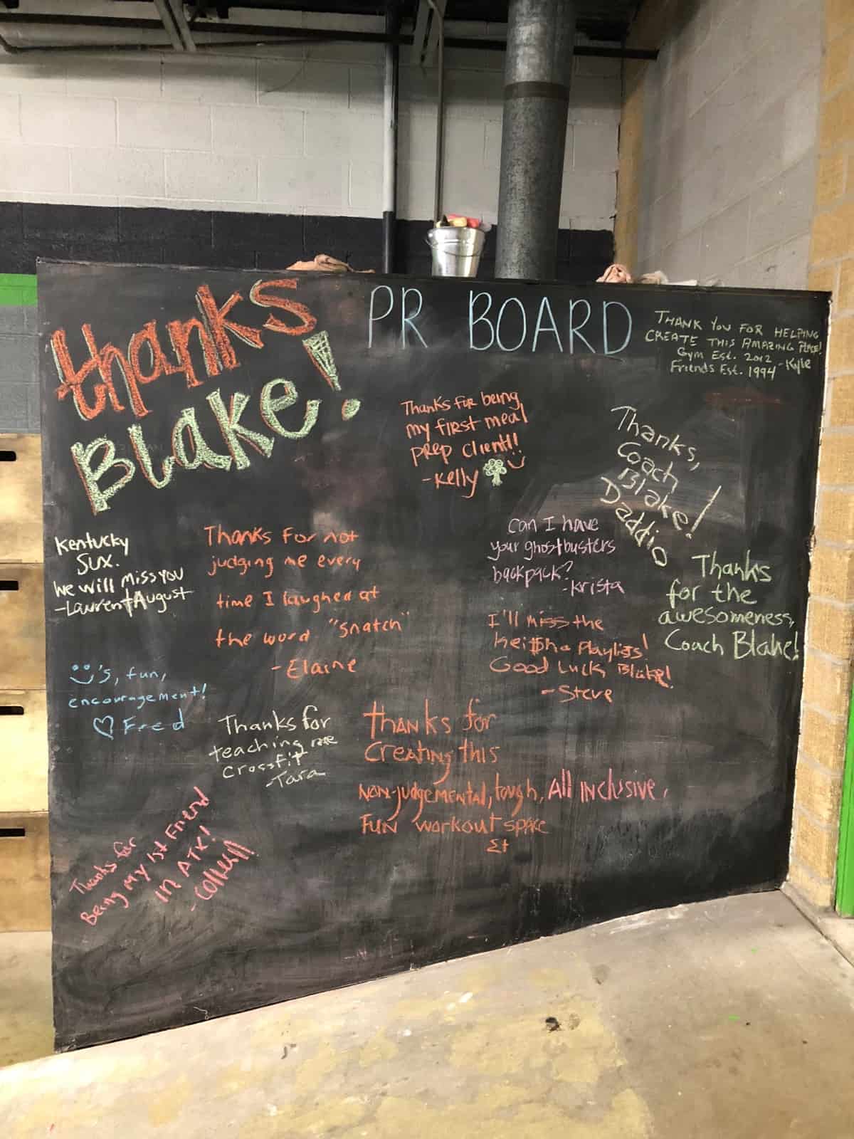 Huge chalkboard of a going away board for someone in a gym