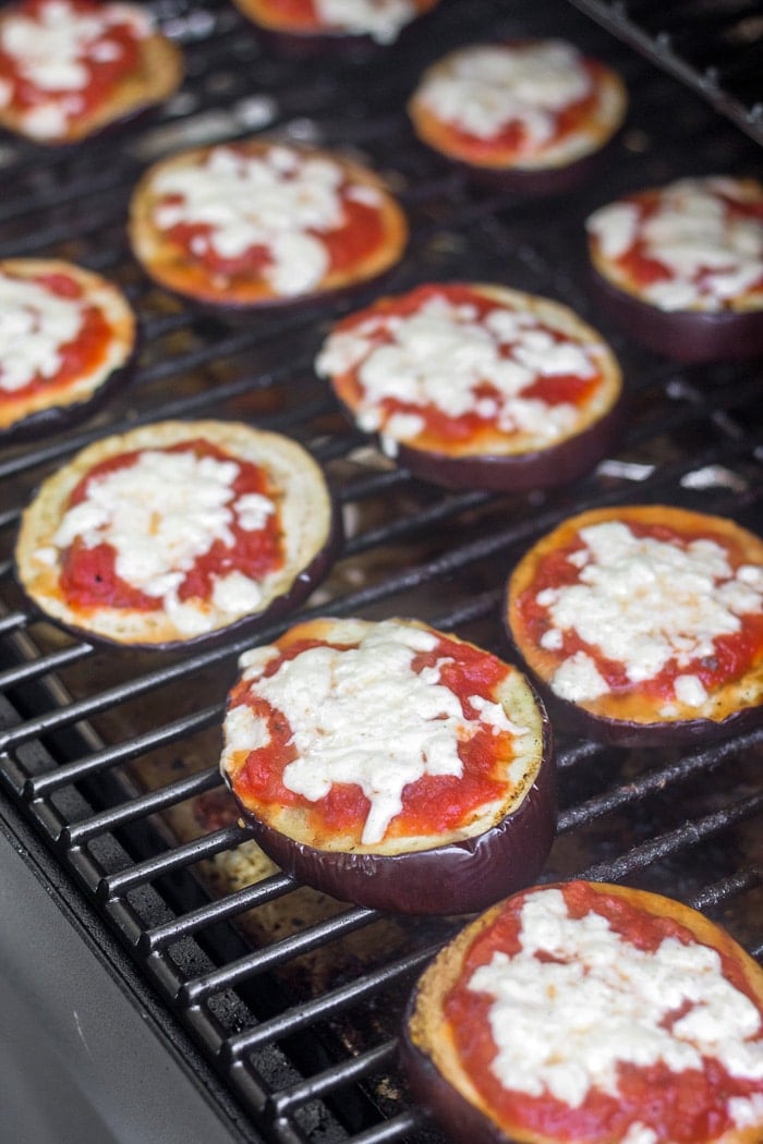 Keto eggplant pizzas on a grill.