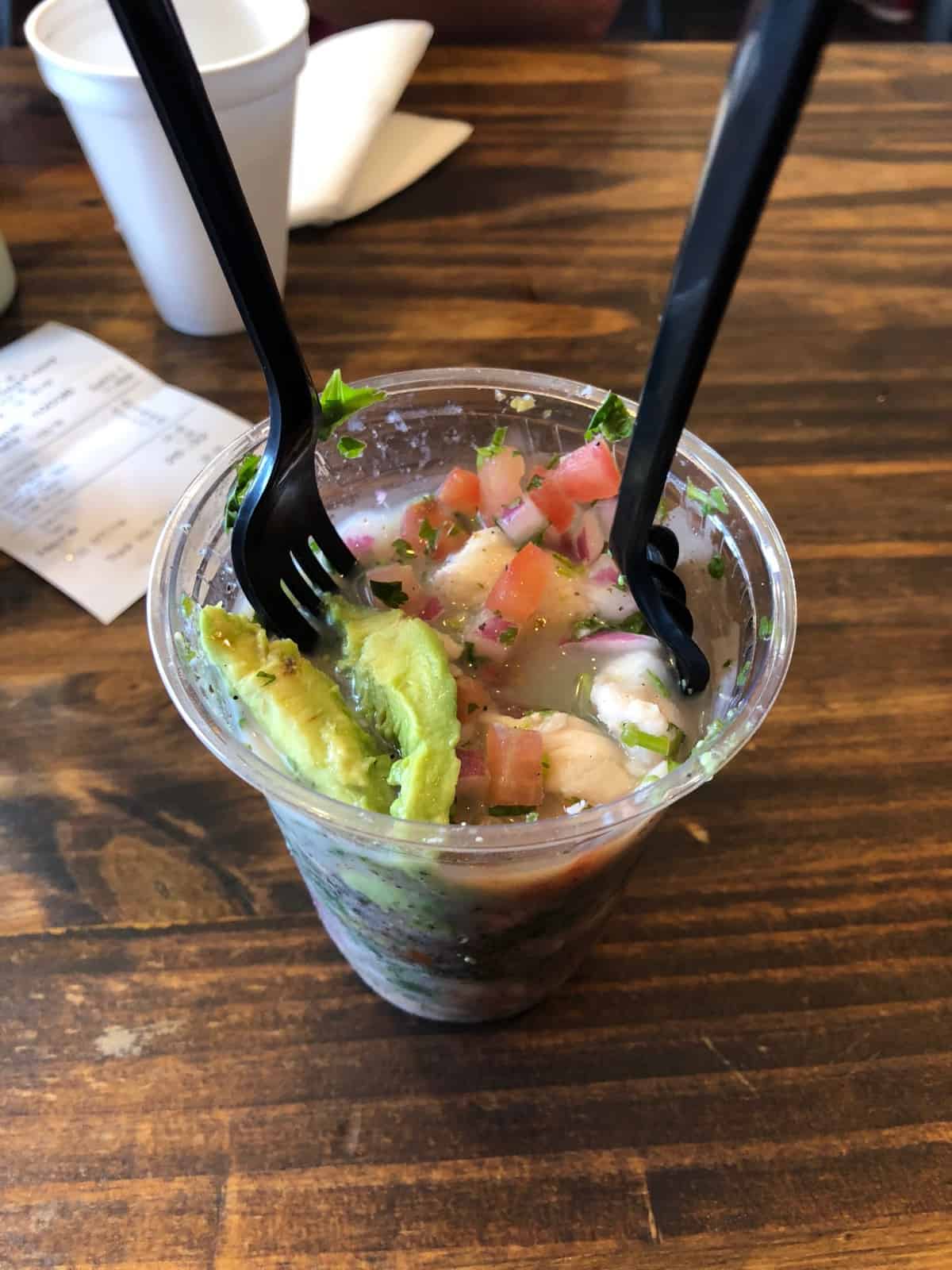 Plastic cup of fish and shrimp ceviche from Oscar's in San Diego