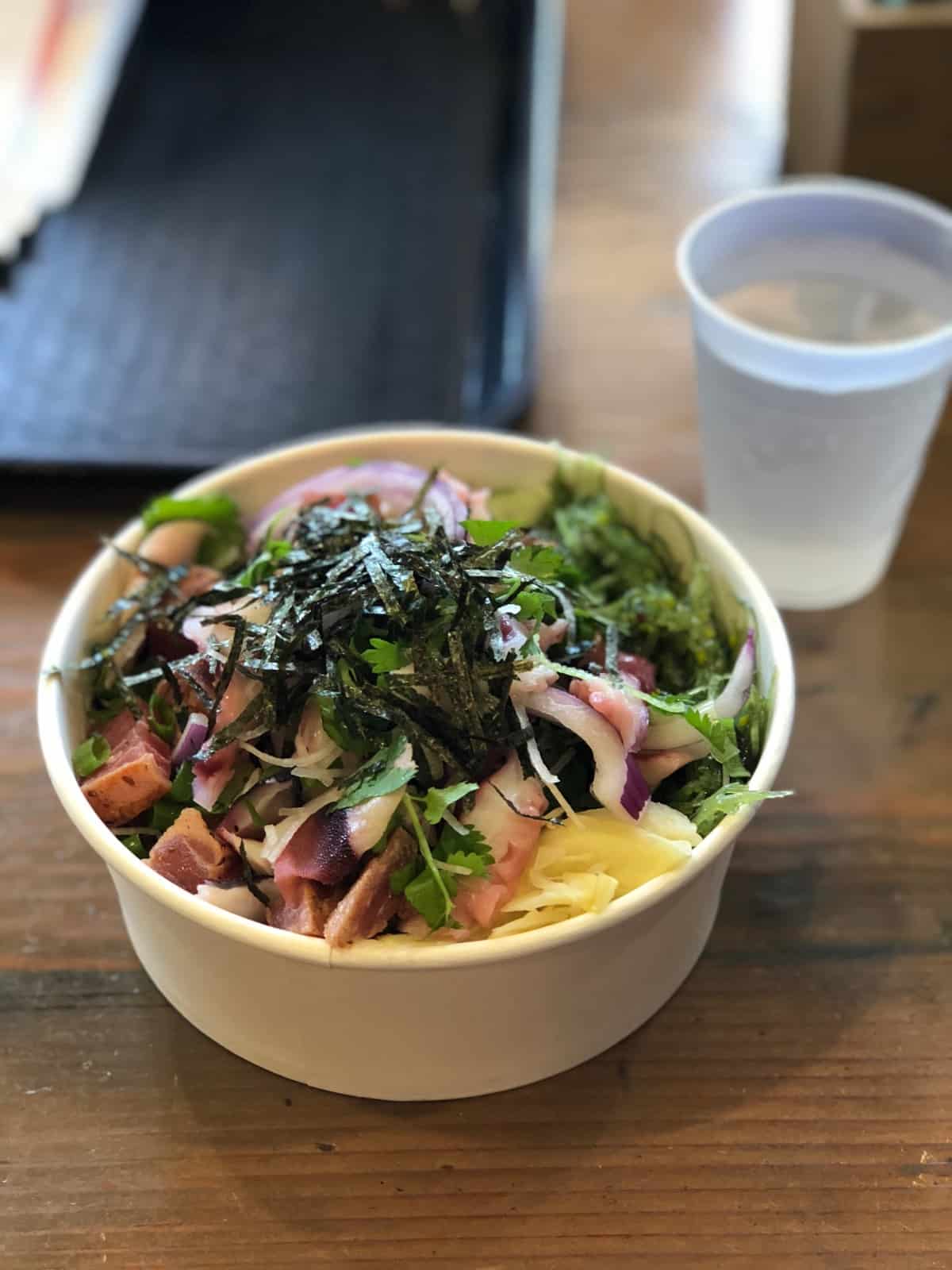 Poke bowl with tuna and octopus, seaweed salad, and ginger from Poke Chop in San Diego, CA