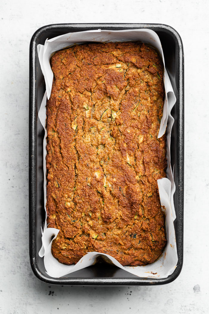 Overhead shot of paleo zucchini banana bread in a bread loaf pan.