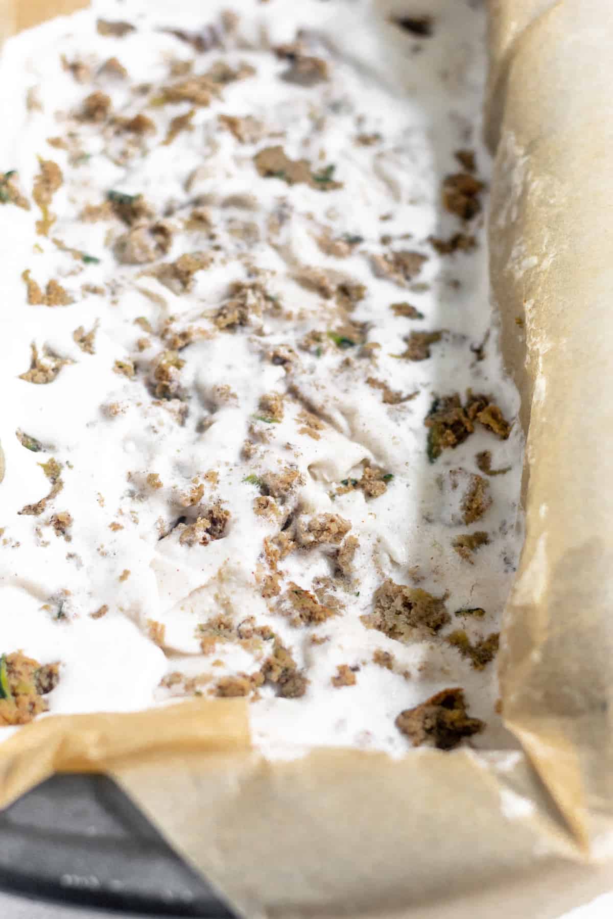 Loaf pan filled with frozen Dairy Free Paleo Zucchini Bread Ice Cream