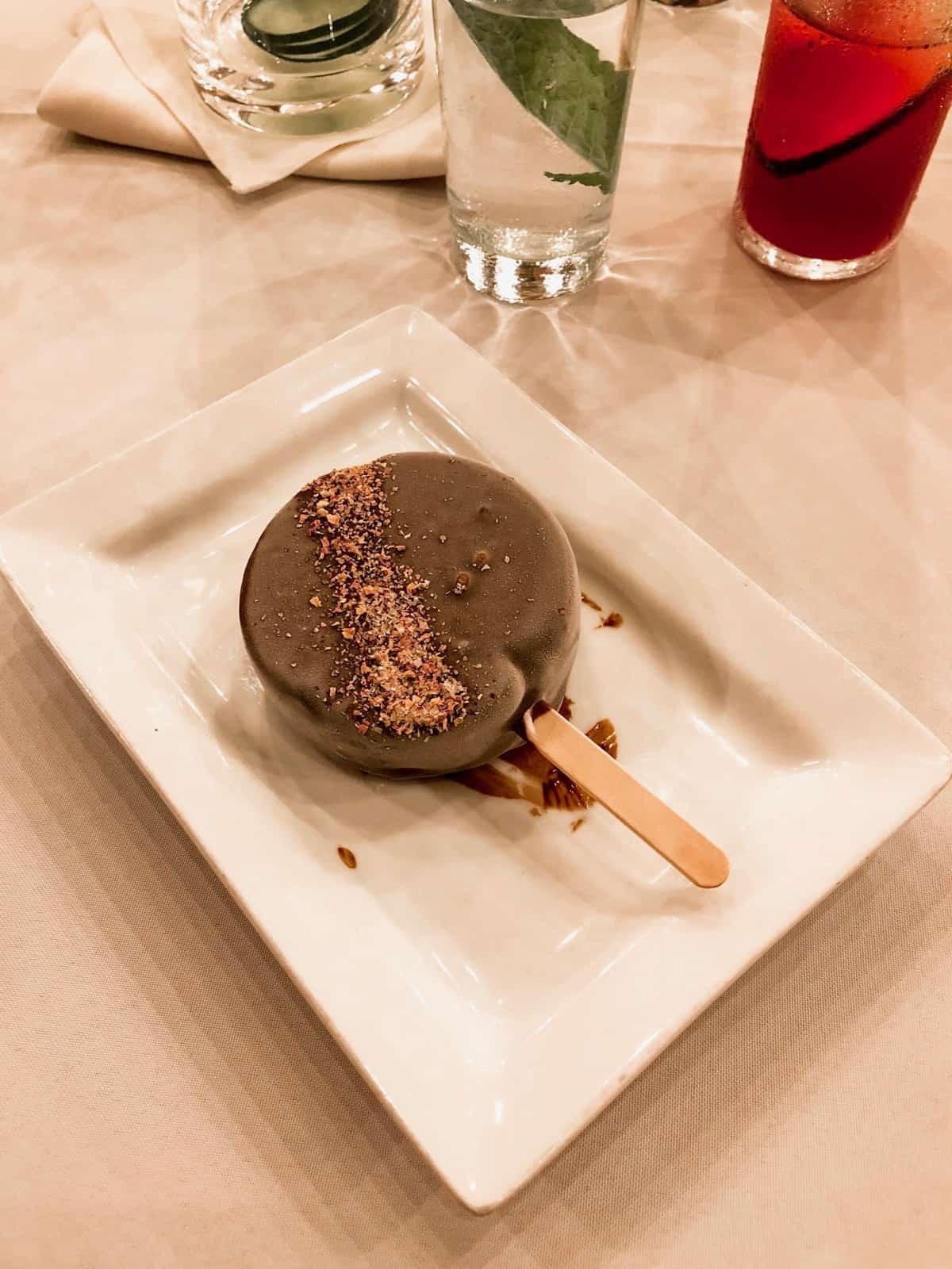 A vegan sweet beet and ginger ice cream bar on a white plate