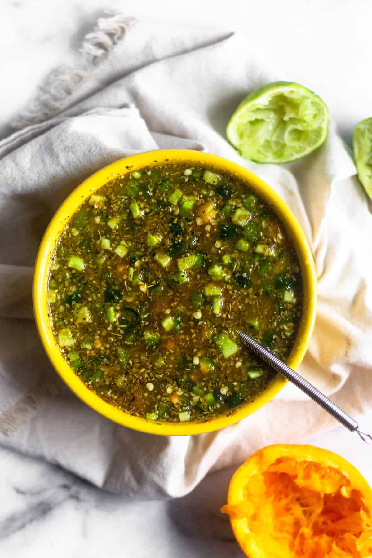 A bowl of marinade that is going to go on a citrus grilled turkey breast.