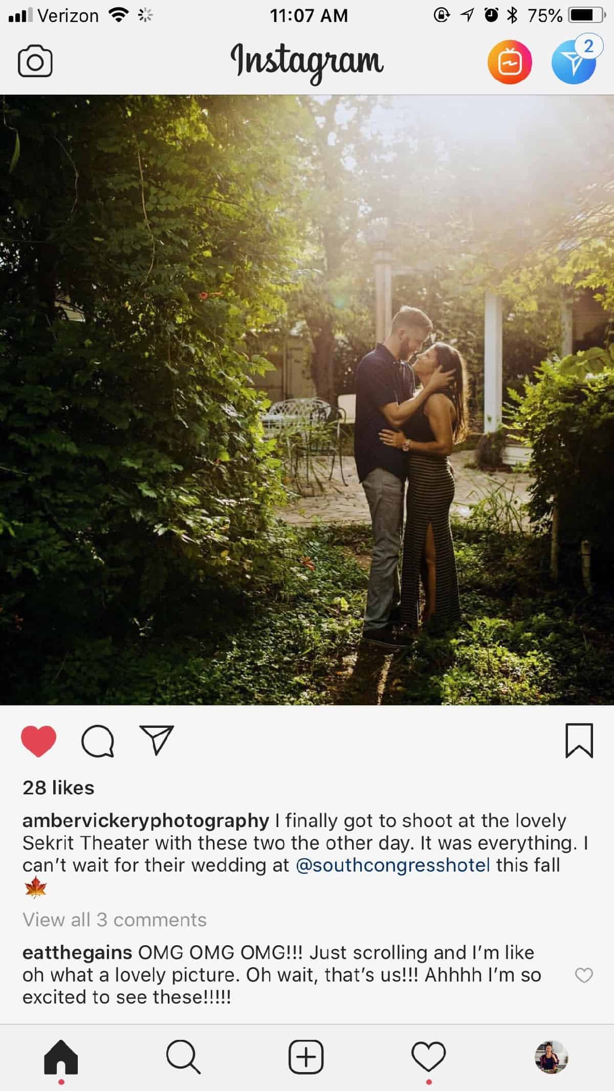 Screenshot from Instagram of a couple embracing each other around a bunch of greenery