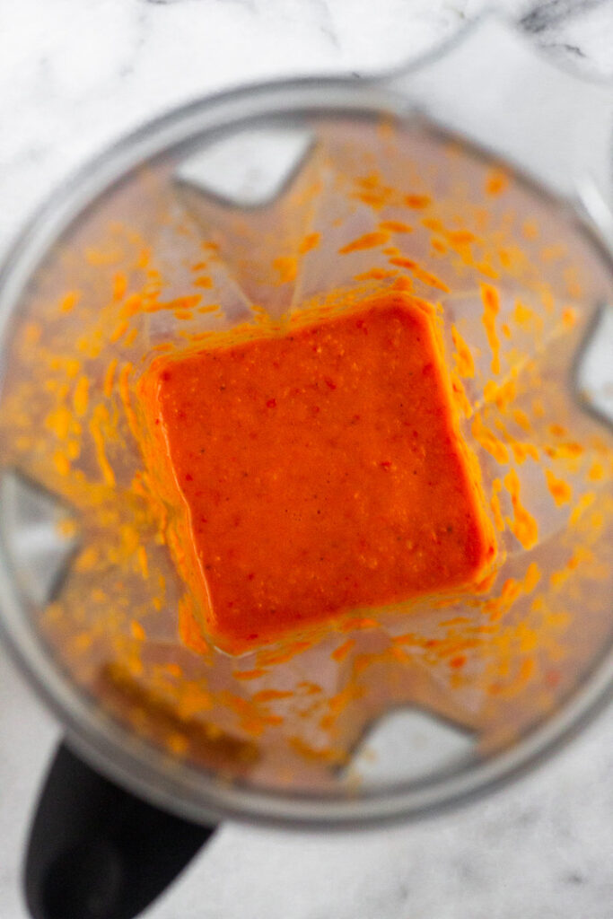 Spicy red pepper sauce in a blender.
