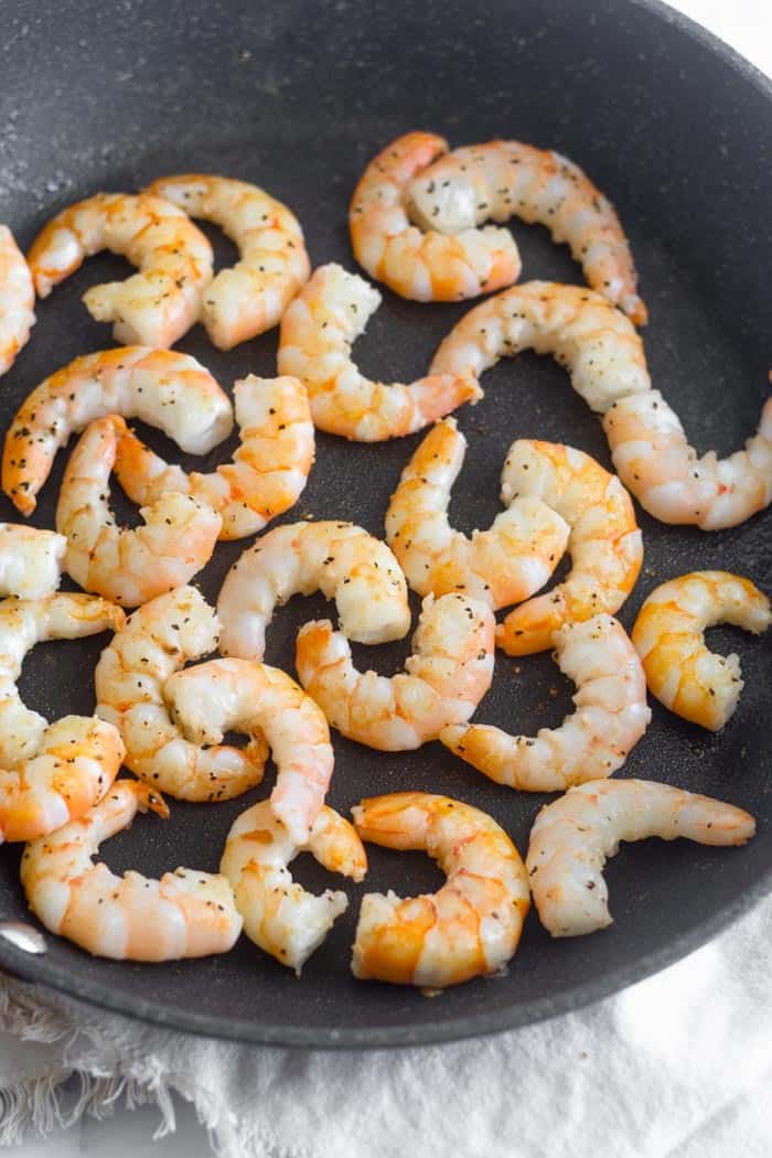 A large pan of cooked shrimp