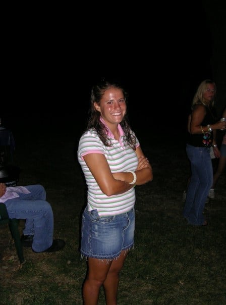 A girl school girl in a jean skirt and a polo shirt