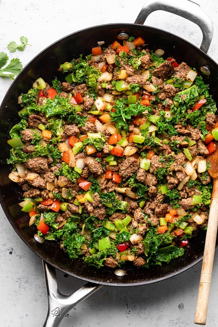 Overhead pan filled with sautéed ground beef and veggies.