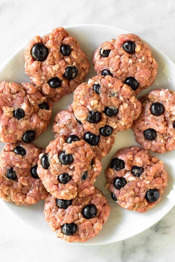 Plate of blueberry pork breakfast sausage patties before they are cooked.
