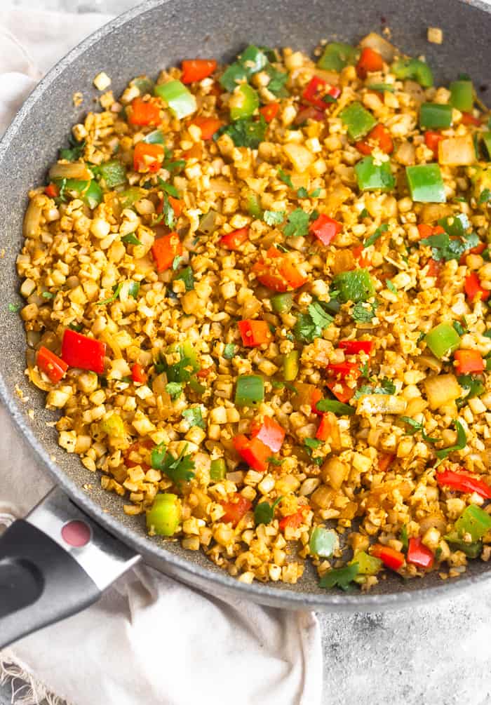 Large skillet filled with fajita cauliflower rice.
