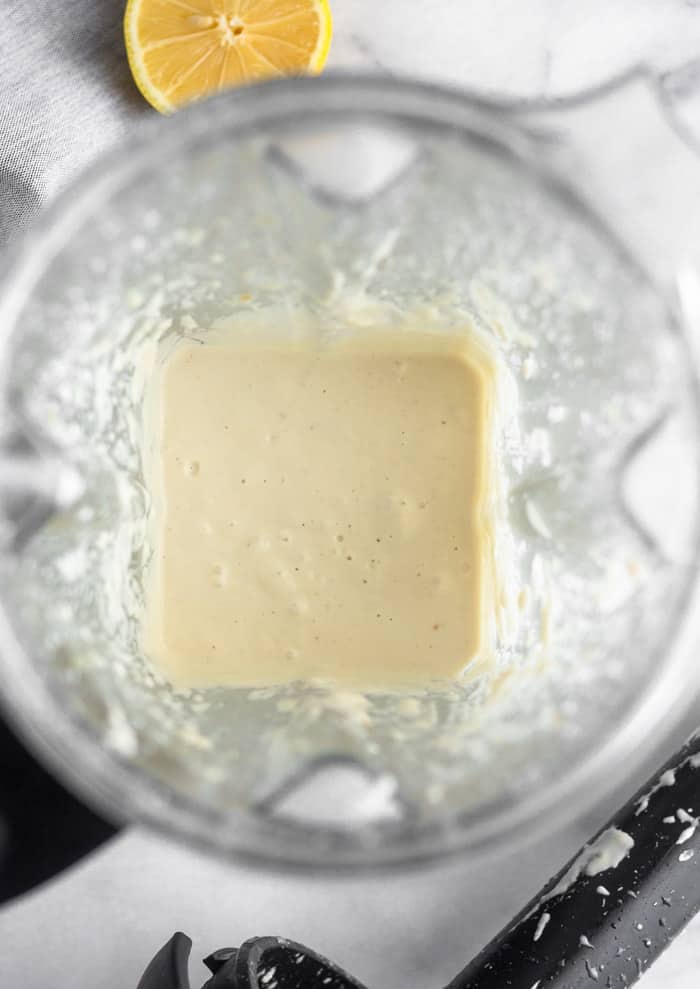 A blender filled with dairy free already sauce.