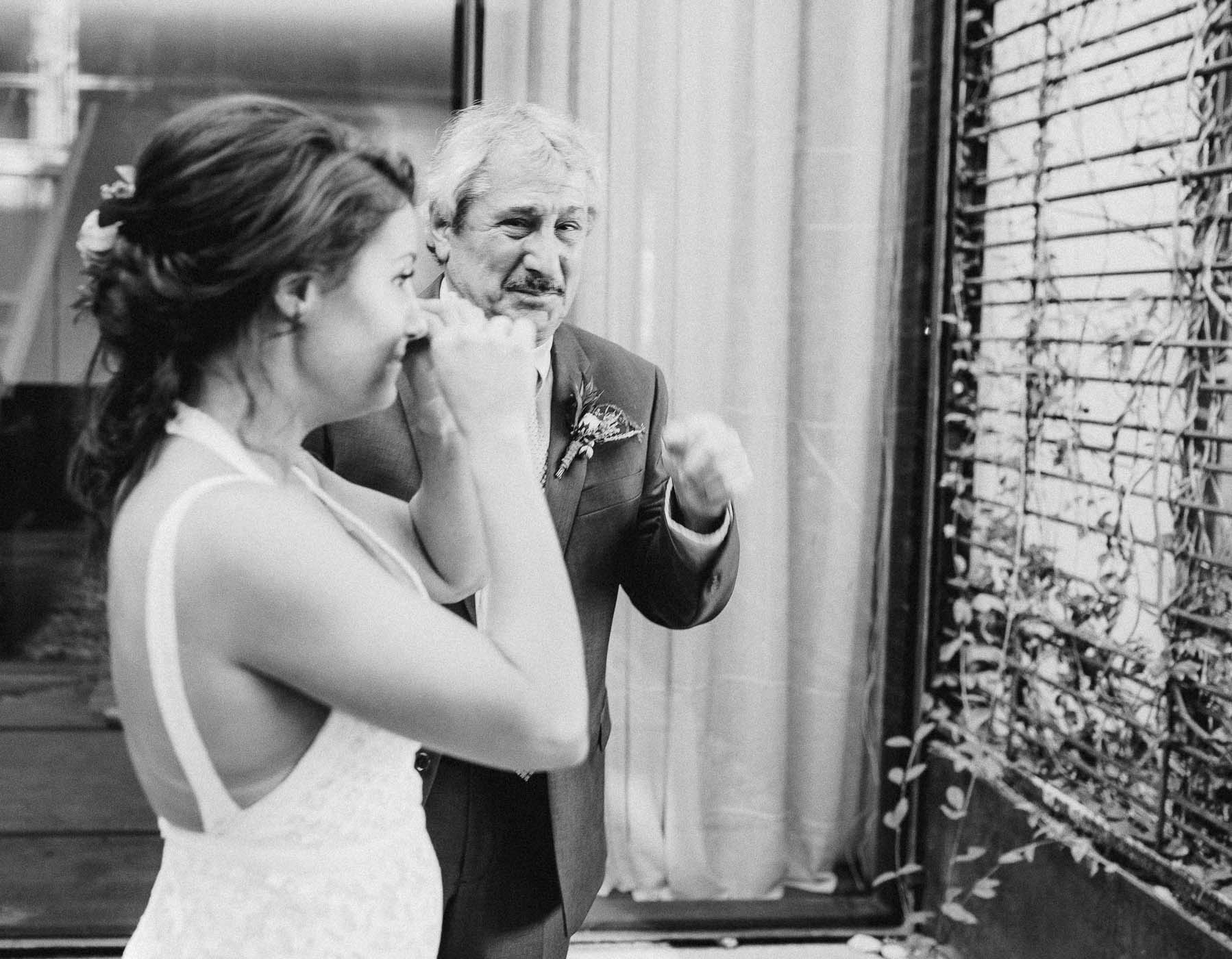 Father and daughter crying on her wedding day.