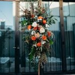 Flowers on a brass arch in a wedding.