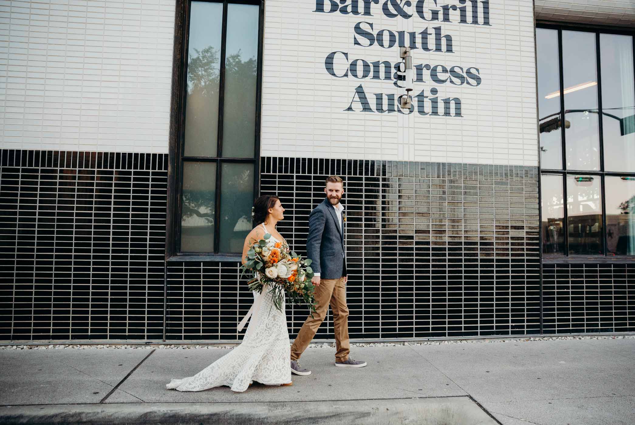 Bridge and groom walking on South Congress Avenue in Austin right after they got married.
