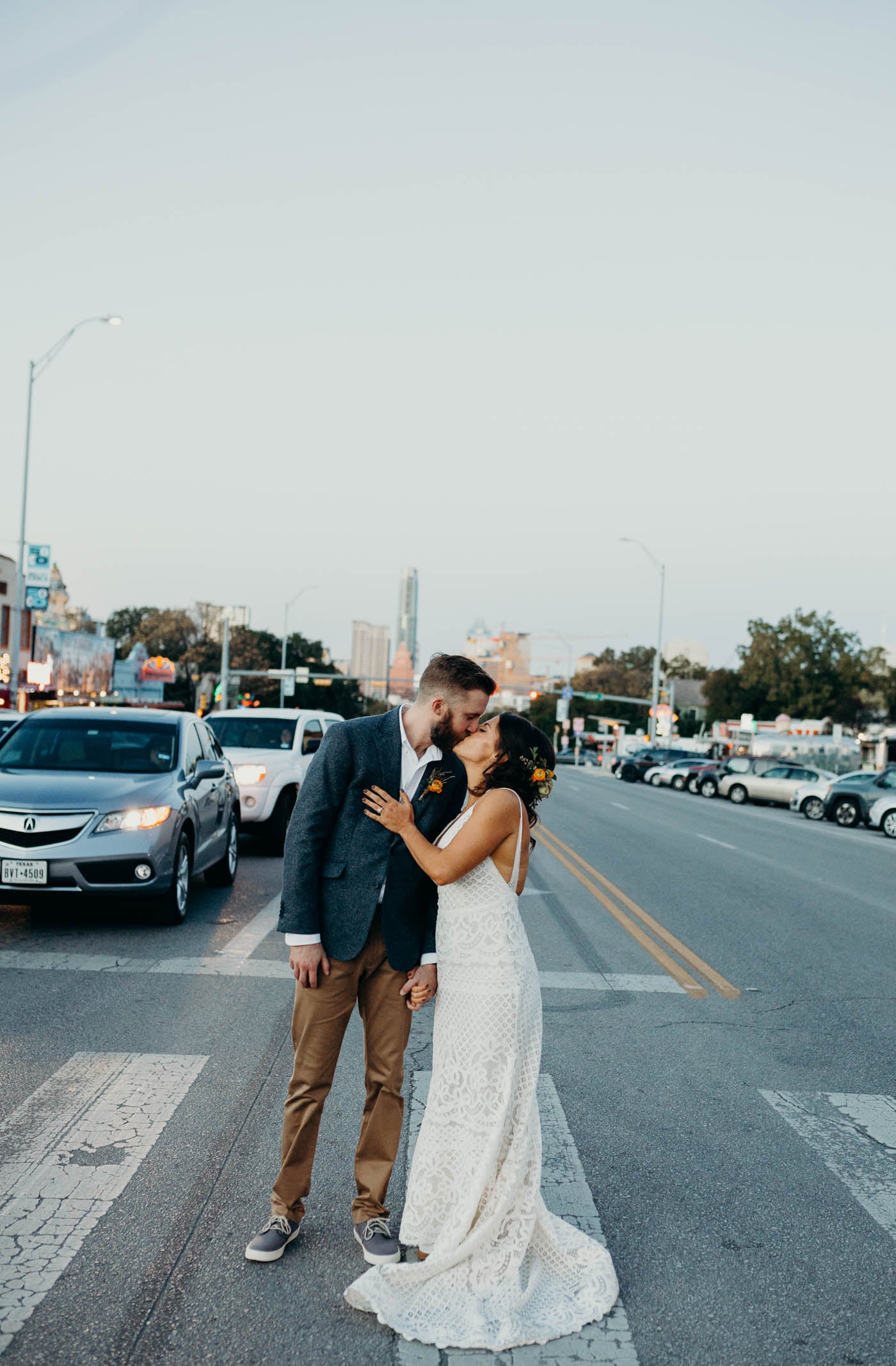 Bridge and groom kissing in the middle of South Congress Street right after they were married.