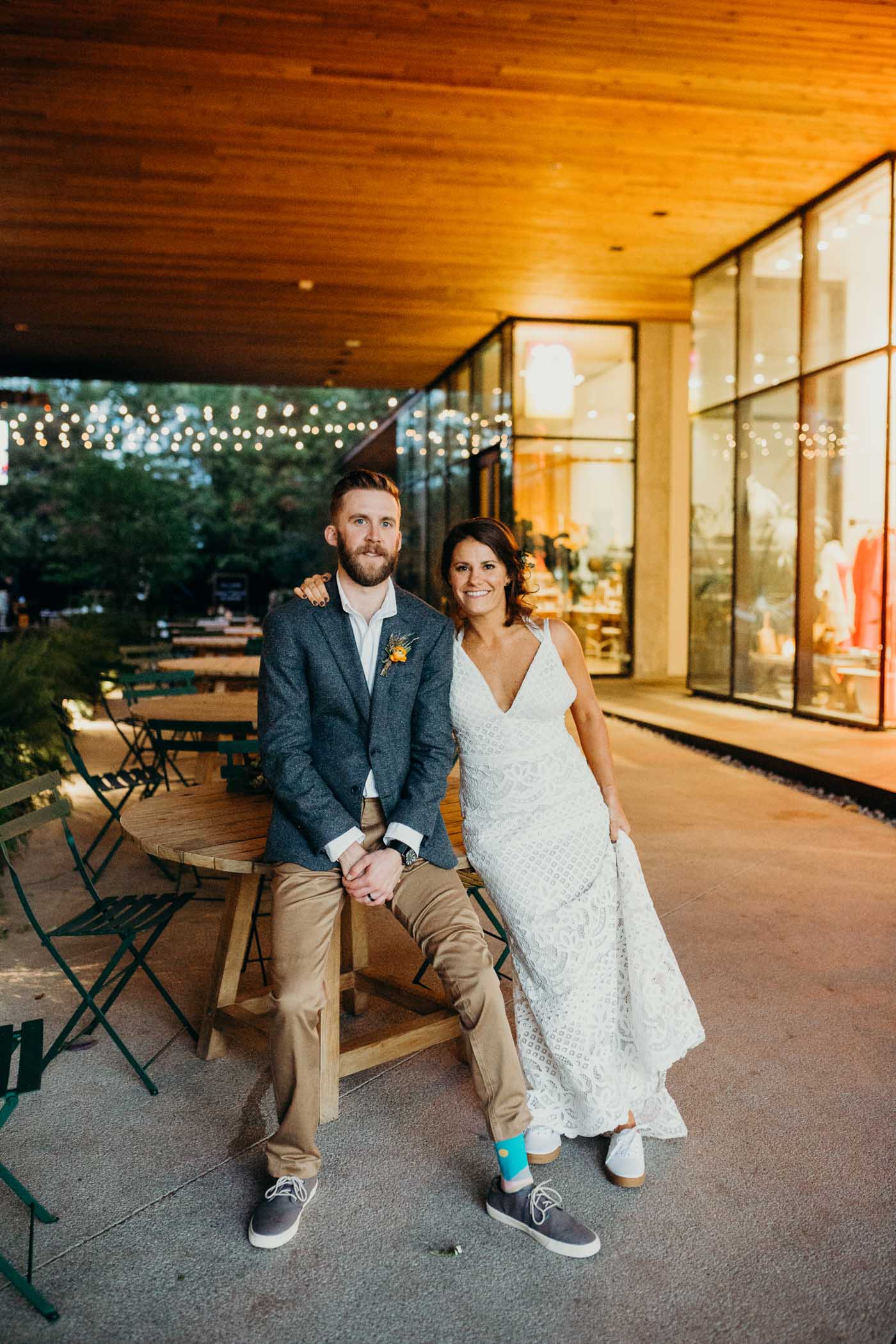 Bride and groom posing after they were married in front of South Congress Hotel.