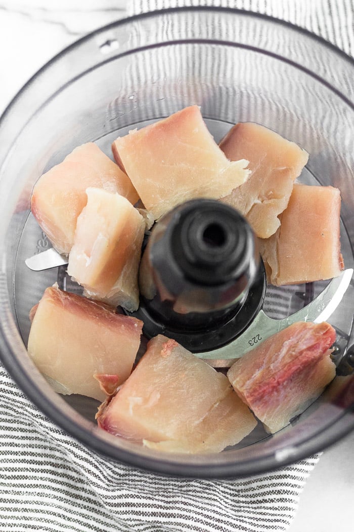 Fresh raw Mahi Mahi in a food processor.