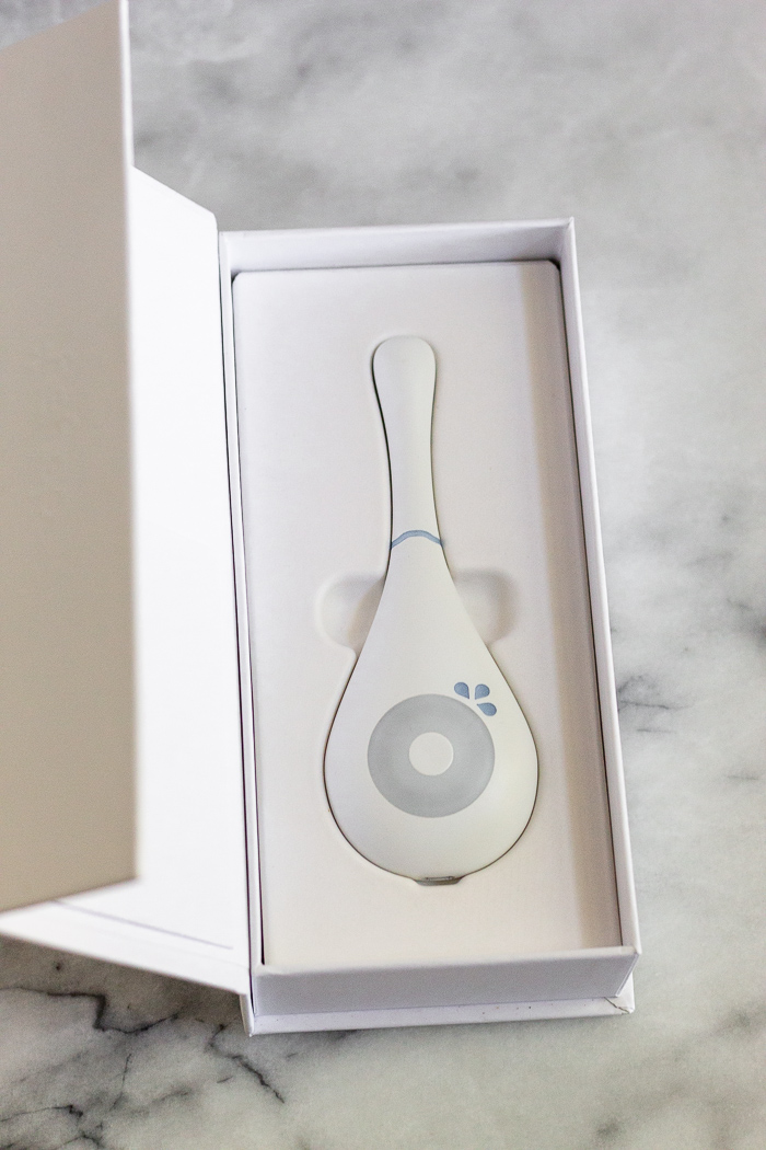 Daysy Fertility Monitor in it's box on a white counter.