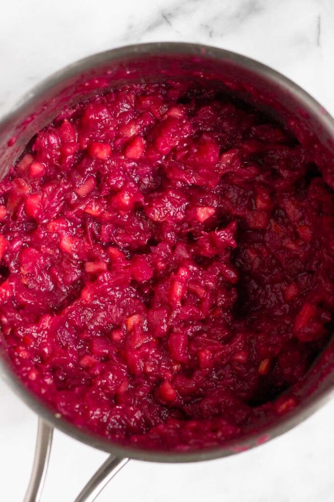 A pot of fresh cranberry sauce.