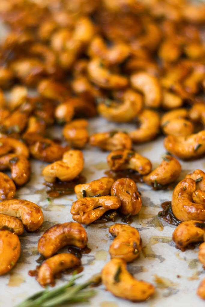 Sheet pan filled with honey roasted cashews with rosemary.
