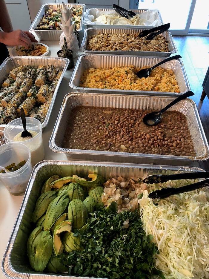 Buffet of Mexican food on a counter.