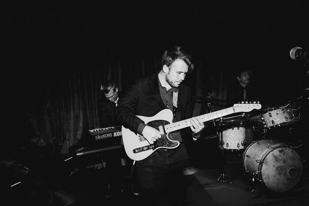 Band member playing the guitar at a wedding.