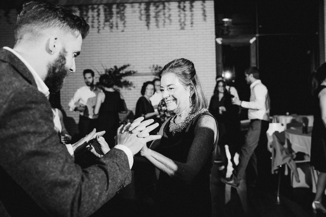 Groom and his mother-in-law dancing at a wedding.