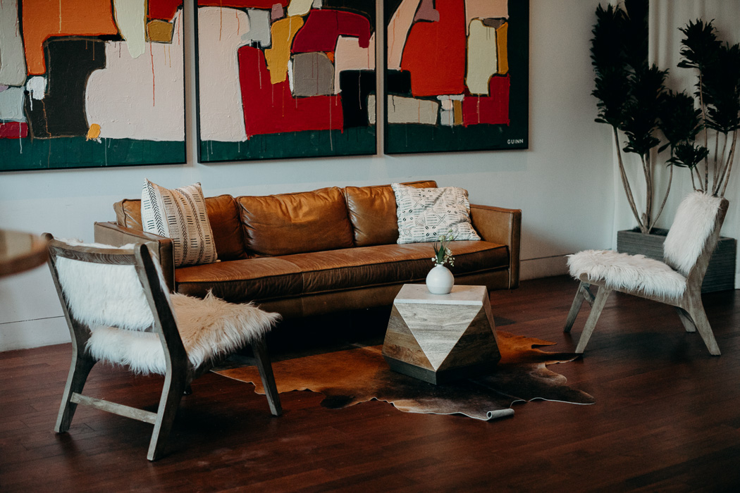 Lounge set up with couches and chairs for cocktail hour for a wedding.