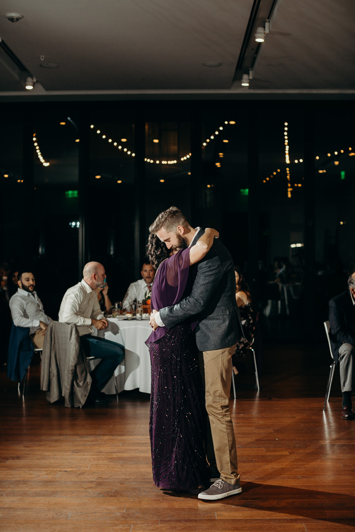 Mother and son dancing on the son's wedding day.