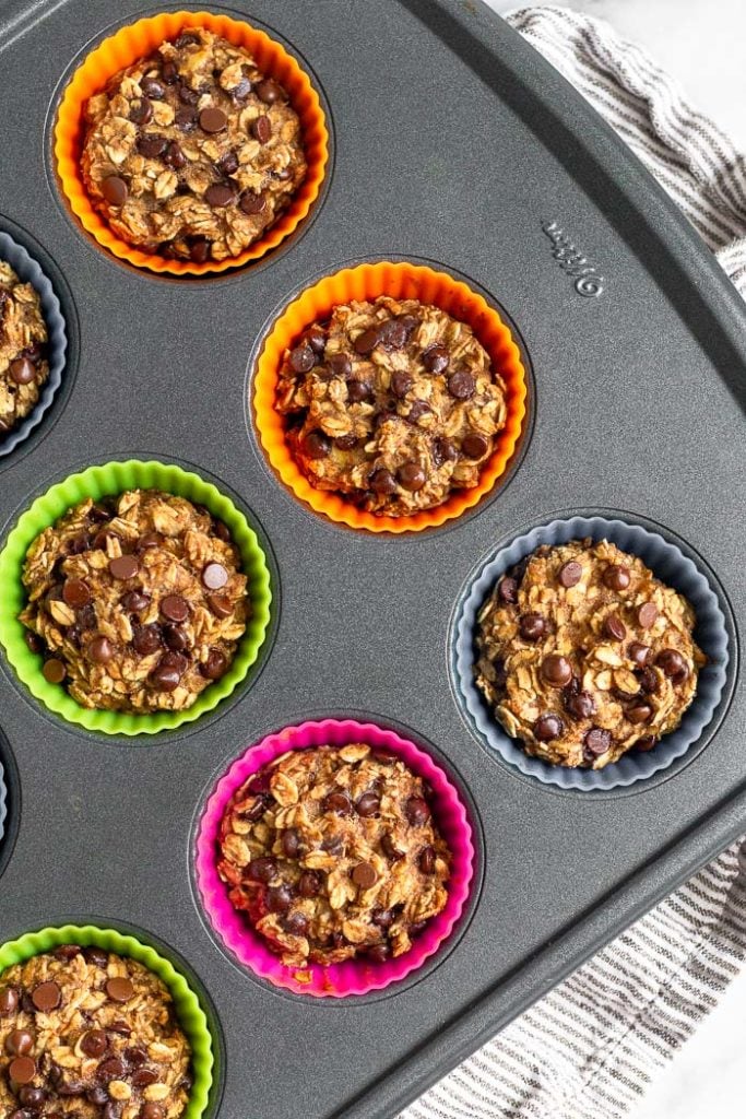 Muffin tin filled with banana oatmeal chocolate chip muffins.