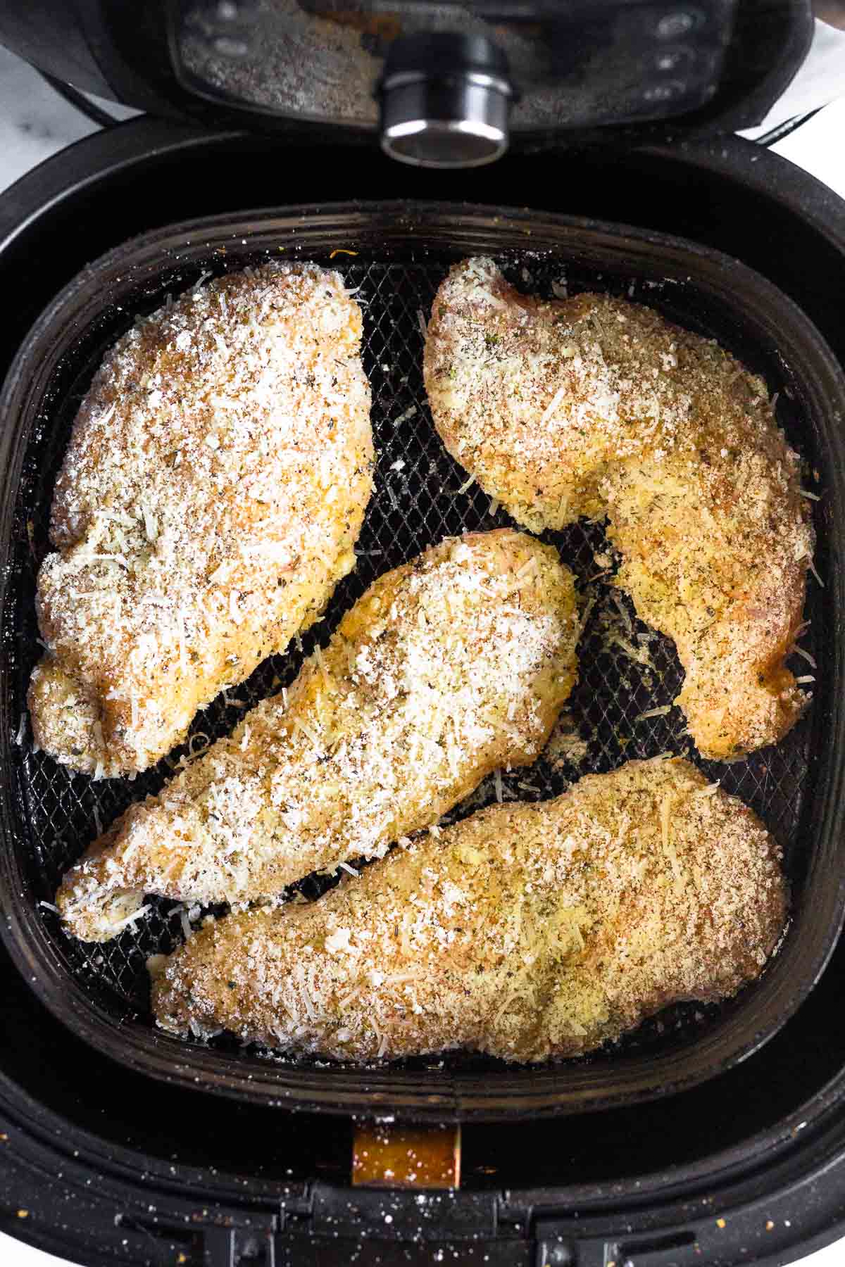 Breaded chicken in an air fryer.