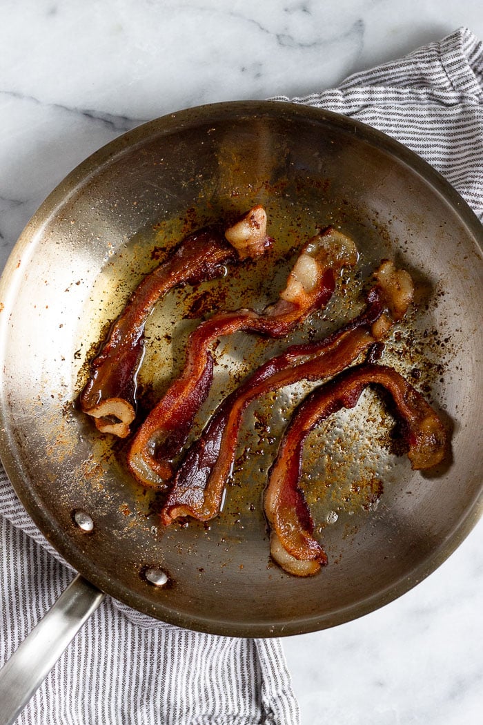 Pan with pan fried bacon in it.