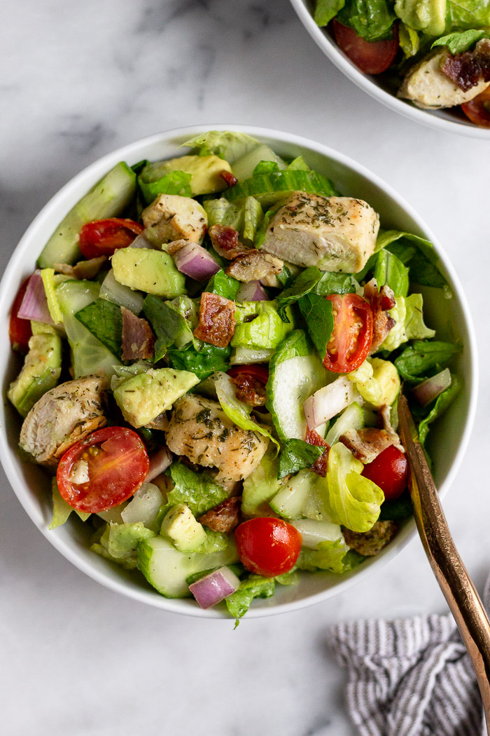 Bowl with whole30 chicken salad with a fork coming out of it.
