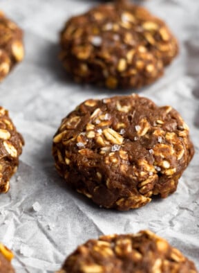 No bake protein cookies sprinkled with flaky sea salt on a baking sheet.