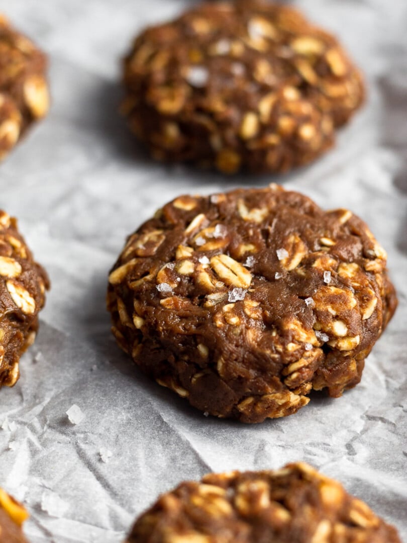 No bake protein cookies sprinkled with flaky sea salt on a baking sheet.