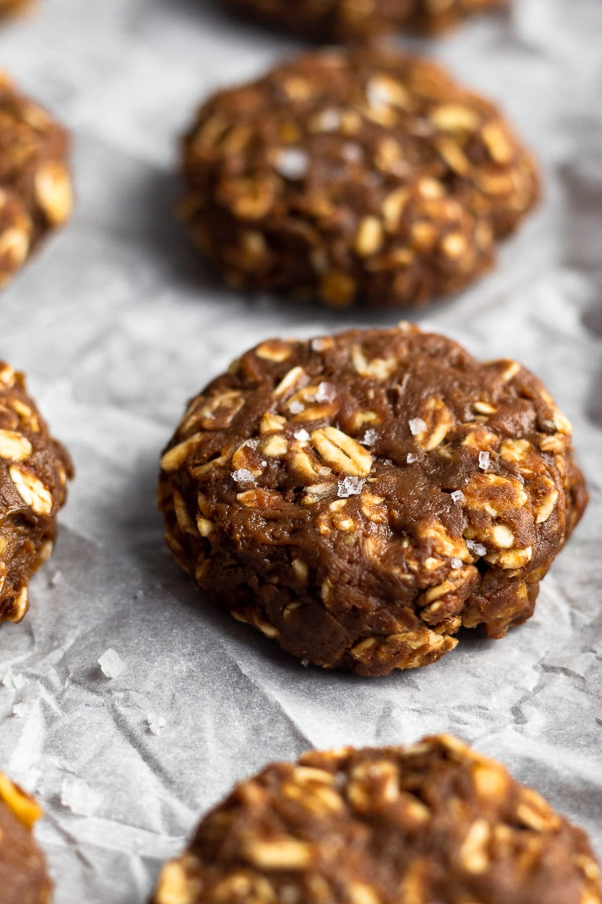 No bake protein cookies sprinkled with flaky sea salt on a baking sheet.