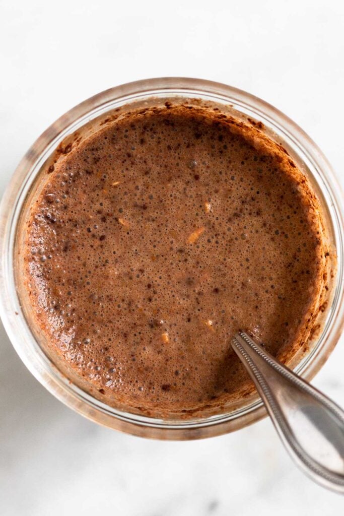 Overnight oats in a jar before they set in the fridge.