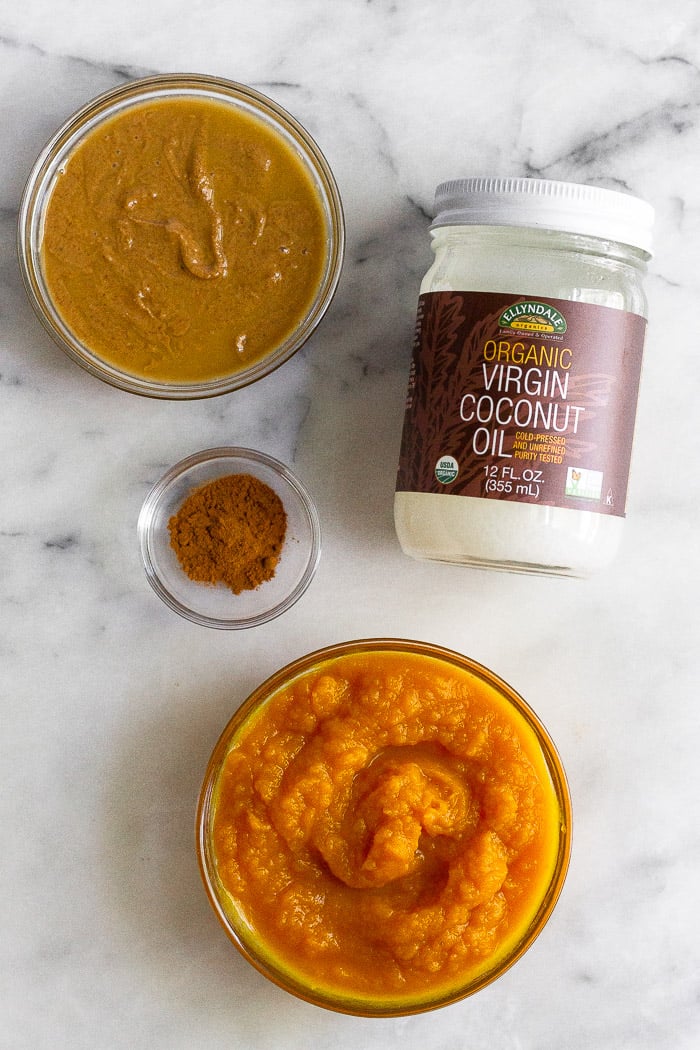 A bowl of pumpkin, peanut butter, and coconut oil mixed together to make homemade dog treats.